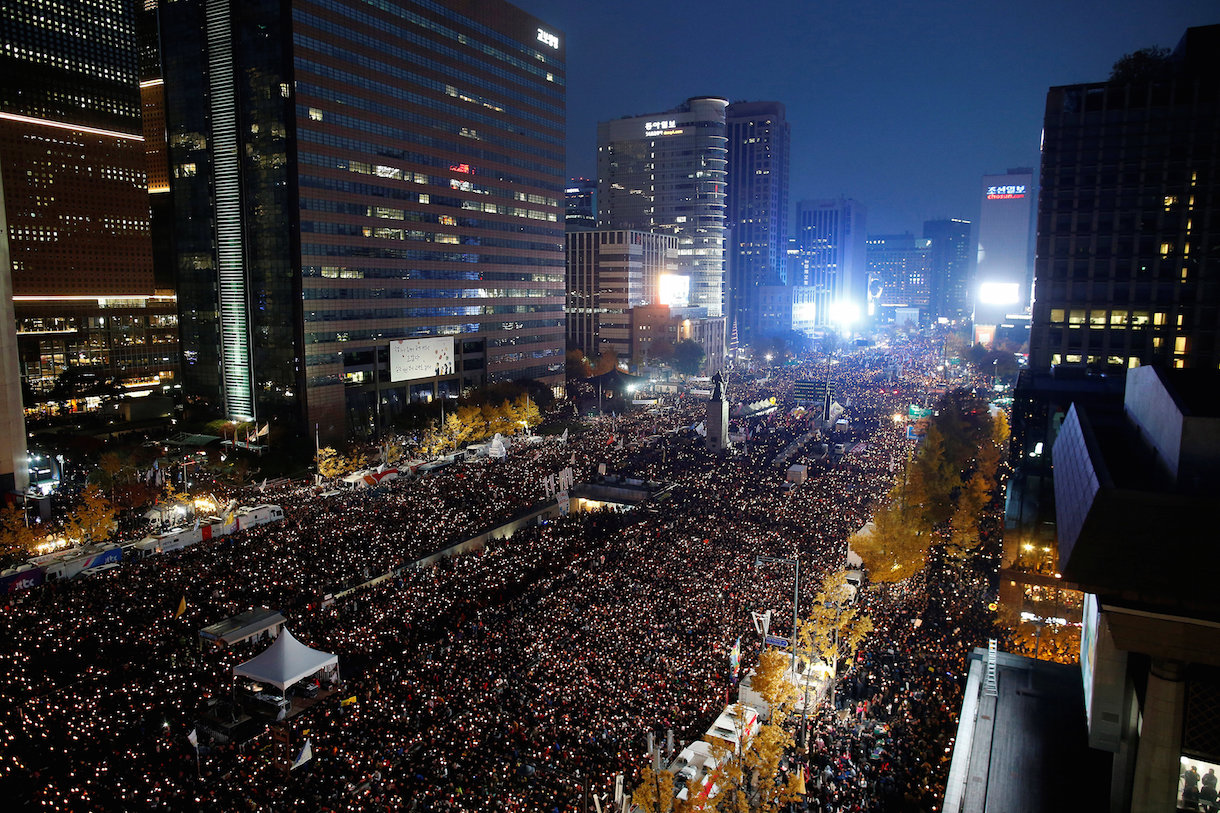 People take part in a rally calling for President Park Geun-hye to step down in central Seoul, South Korea, November 12, 2016. REUTERS/Kim Hong-Ji TPX IMAGES OF THE DAY